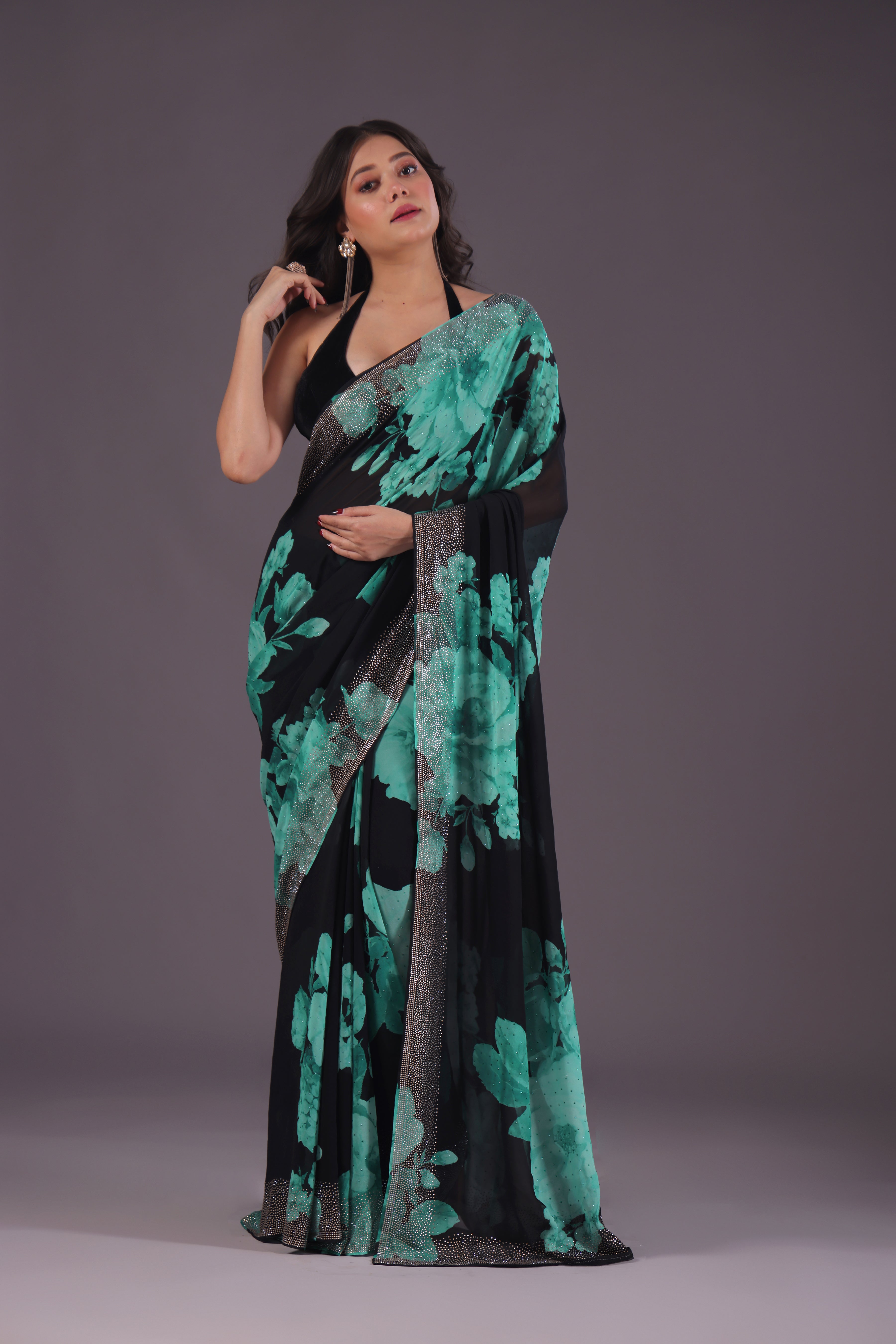 Elegant black crepe satin saree adorned with high-resolution digital print patterns, showcasing a soft sheen, fluid drape, and contemporary festive appeal.