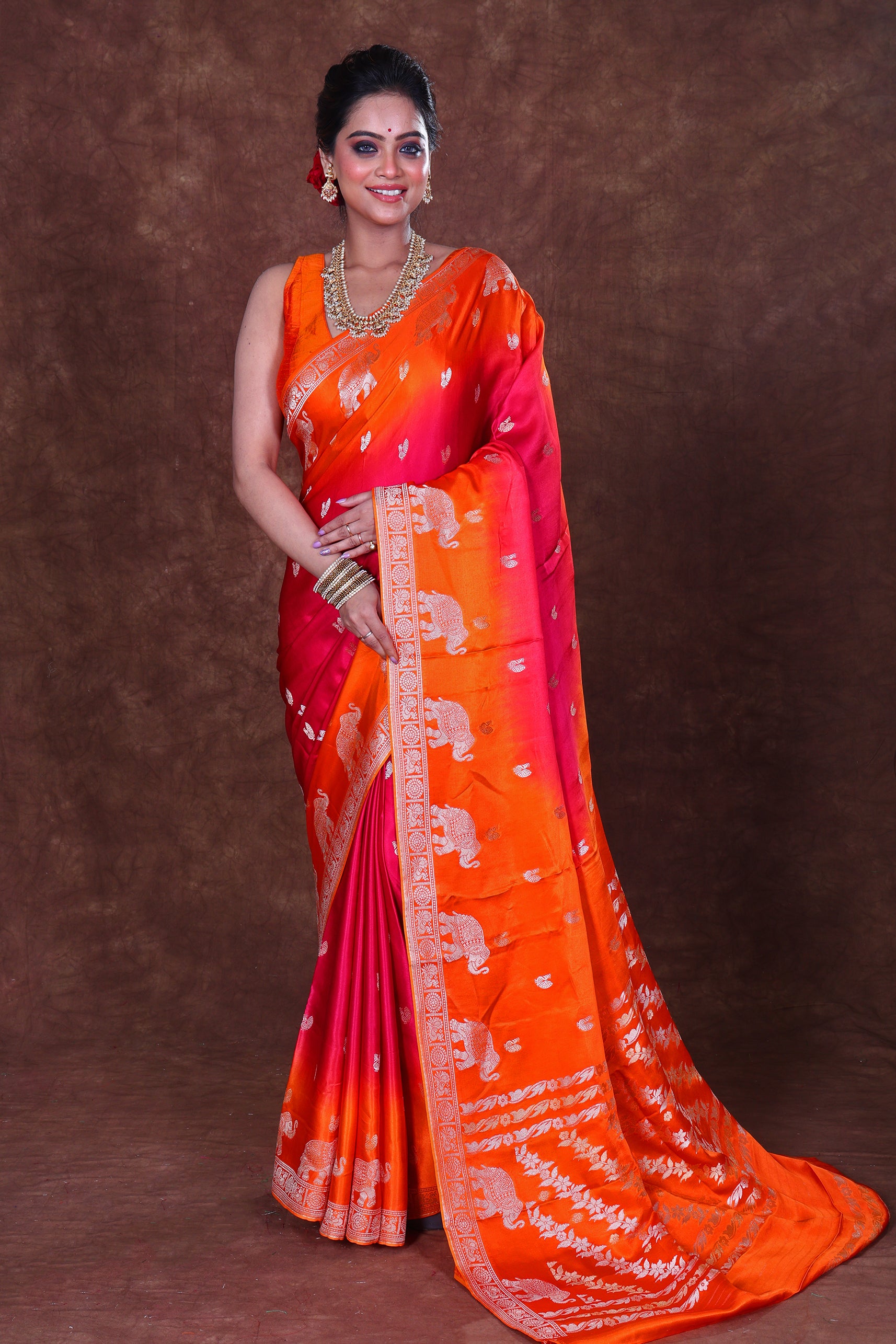 Lightweight shaded semi mashru fabric showing a soft gradient blend of colors, smooth glossy finish on the surface, and fine traditional weave texture.