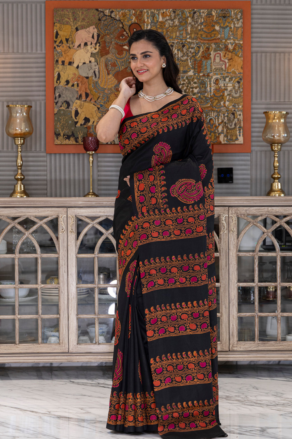 Elegant silk saree adorned with traditional hand block-printed floral and geometric motifs, showcasing rich colors and a soft, lustrous finish.